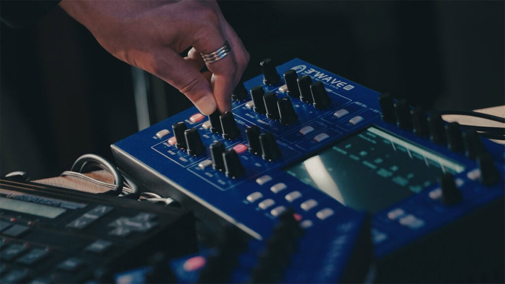 Coloray adjusting the filter on the 8M's bassline in his live performance